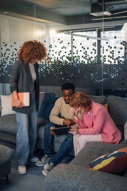 istock Interracial businesspeople with tablet brainstorming at office lobby 2152657833