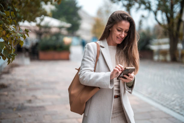istock Tech-Savvy Mid Adult Enjoying Connectivity in Urban Setting 2152659033