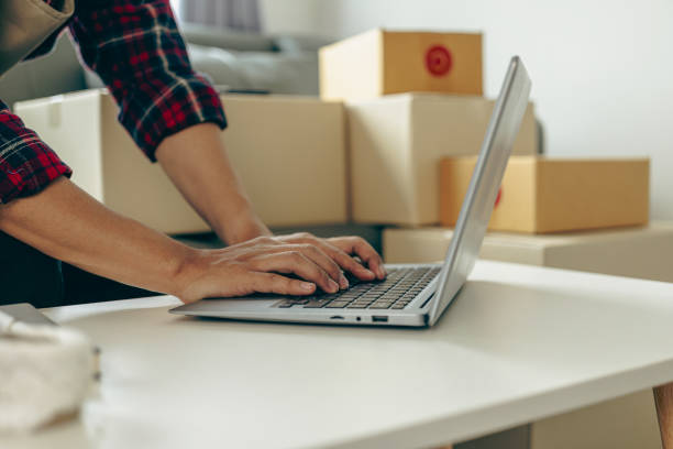 istock Entrepreneurs, small and medium sized businesses working in home offices using computers, shipping boxes, packaging, online marketing. SME Telemarketing Concepts, Close-Up Pictures 2152660974