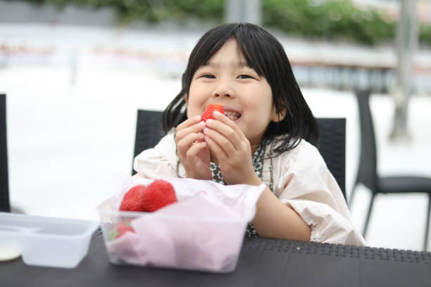 A girl enjoying strawberry picking