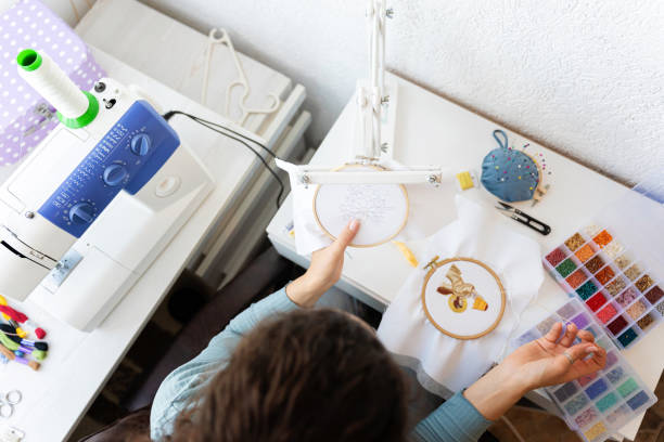 A young entrepreneur seamstress crafting dreams through her embroidery work, blending skill and creativity to bring unique designs to life. This picture captures the essence of small business ambition and artistic talent.