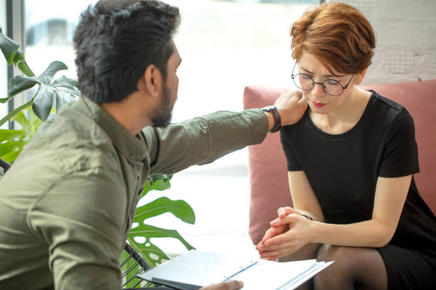 istock Therapist cheering up his extremely depressed patient 2152669371