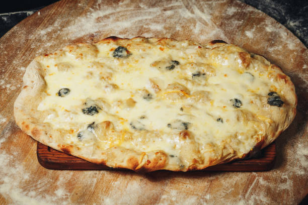 Sizzling Slice: Tempting Pizza on Wooden Board