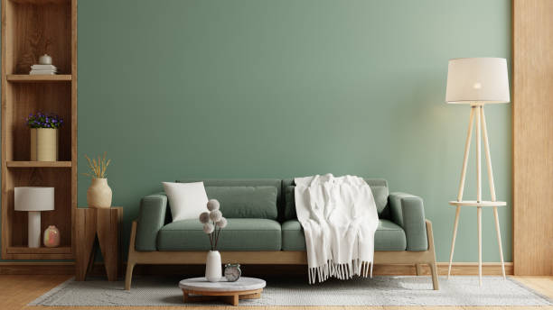 istock Green sofa with table on green wall and wooden flooring,Minimalist design- 3D rendering 2152670208