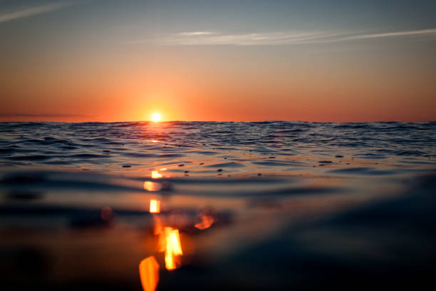 Sunrise in dark water captured in sea level