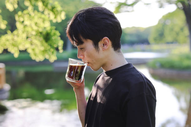 istock Shots focused on the hand holding the coffee 2152674628