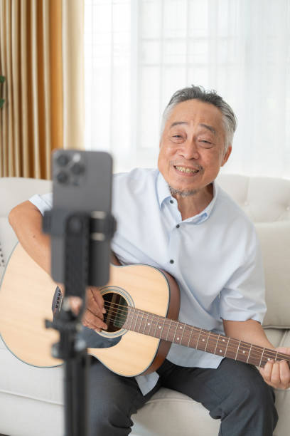 istock Senior Man Video Chatting with Guitar. 2152674639