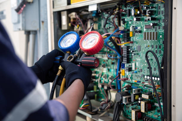 istock Air conditioning, HVAC service technician using gauges to check refrigerant and add refrigerant,Air Conditioning Repair, repairman on the floor fixing air conditioning system. 2152674729