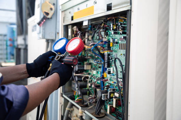 istock Air conditioning, HVAC service technician using gauges to check refrigerant and add refrigerant,Air Conditioning Repair, repairman on the floor fixing air conditioning system. 2152674731