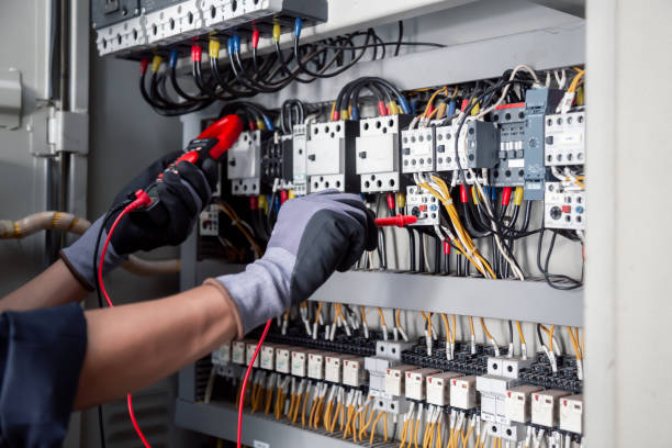 istock Electricity and electrical maintenance service,Electrical tests industrial electrical circuits with a multimeter in the control terminal box. 2152674739