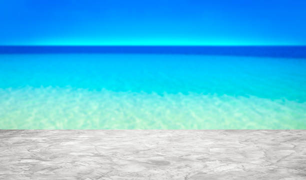 istock Cement counter top empty and background beach sand  blurred for of decorative design and product display montage ideas 2152677833
