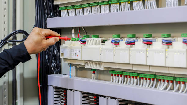 istock An electrical engineer is investigating an electrical control cabinet maintenance concept. 2152681319