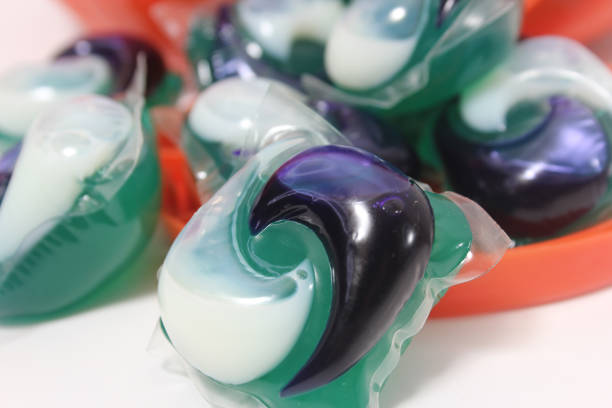 istock Pile of Green and White Laundry Pods on Table 2152681999