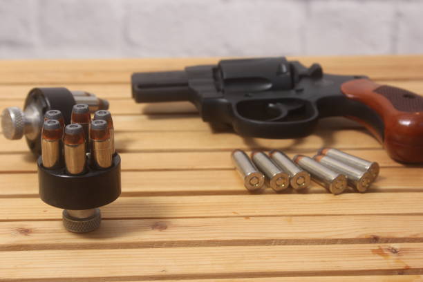 istock Vintage Revolver Gun With Ammunition and Speed Loader 2152682083
