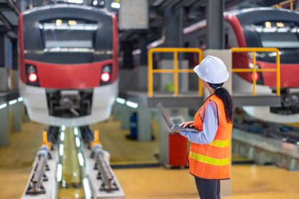 istock Engineer reviews data, updates train maintenance, and ensures safety for quality rail service. 2152684672