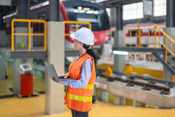 istock Engineer reviews data, updates train maintenance, and ensures safety for quality rail service. 2152684673