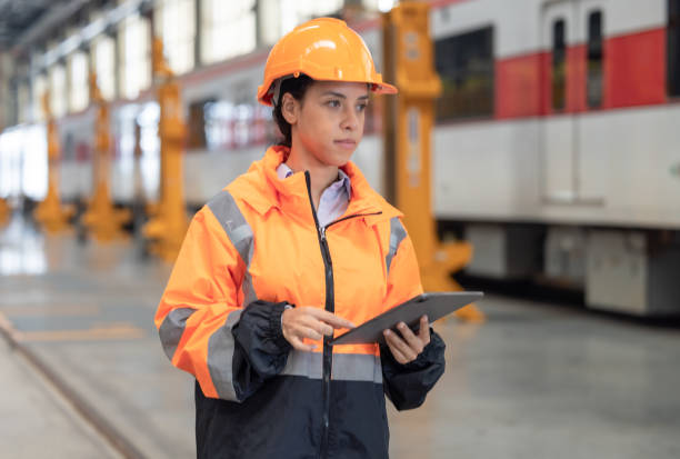 istock Engineer reviews data, updates train maintenance, and ensures safety for quality rail service. 2152684706