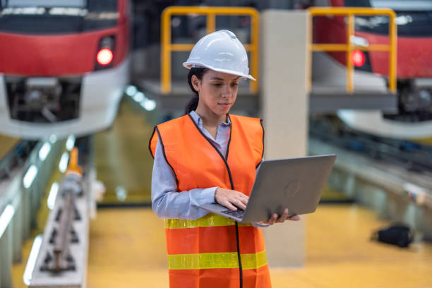 istock Engineer reviews data, updates train maintenance, and ensures safety for quality rail service. 2152684720