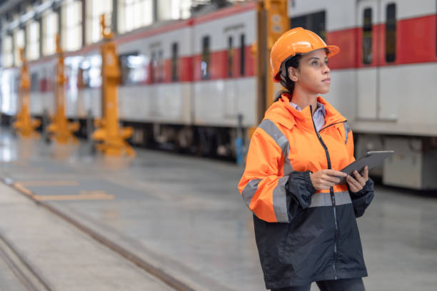 istock Engineer reviews data, updates train maintenance, and ensures safety for quality rail service. 2152684729