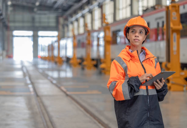 istock Engineer reviews data, updates train maintenance, and ensures safety for quality rail service. 2152684742