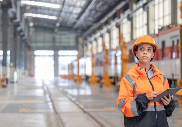 istock Engineer reviews data, updates train maintenance, and ensures safety for quality rail service. 2152684744