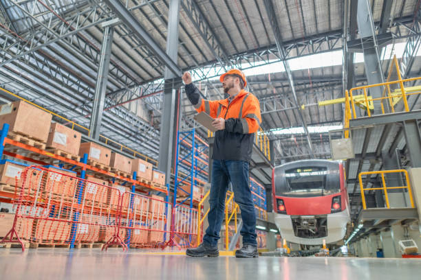 istock Engineer reviews data, updates train maintenance, and ensures safety for quality rail service. 2152685434