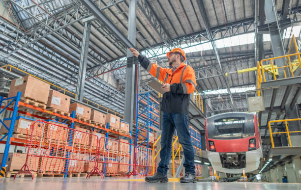 istock Engineer reviews data, updates train maintenance, and ensures safety for quality rail service. 2152685489