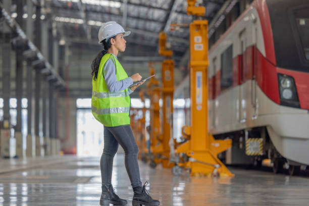 istock Engineer reviews data, updates train maintenance, and ensures safety for quality rail service. 2152685557