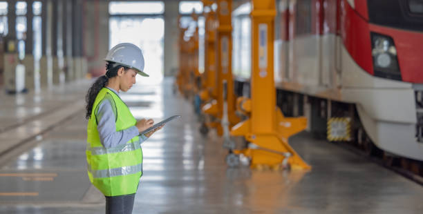 istock Engineer reviews data, updates train maintenance, and ensures safety for quality rail service. 2152685560