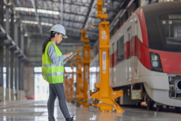 istock Engineer reviews data, updates train maintenance, and ensures safety for quality rail service. 2152685584