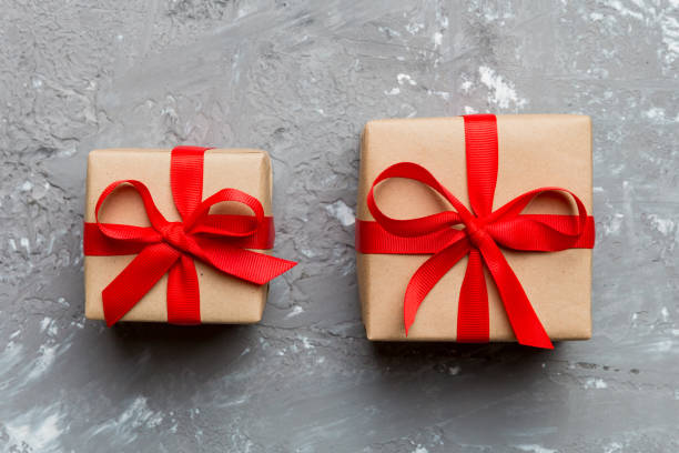 istock Valentine day composition Background: red gift box with bow and heart. Christmas present. View from above. Holday greeting card 2152685932