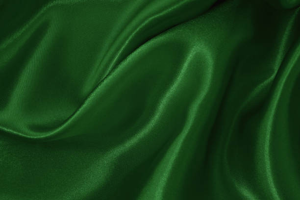 istock Dark green fabric cloth texture for background and design art work, beautiful crumpled pattern of silk or linen. 2152686266