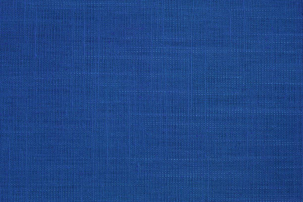 Dark blue linen fabric cloth texture background, seamless pattern of natural textile.