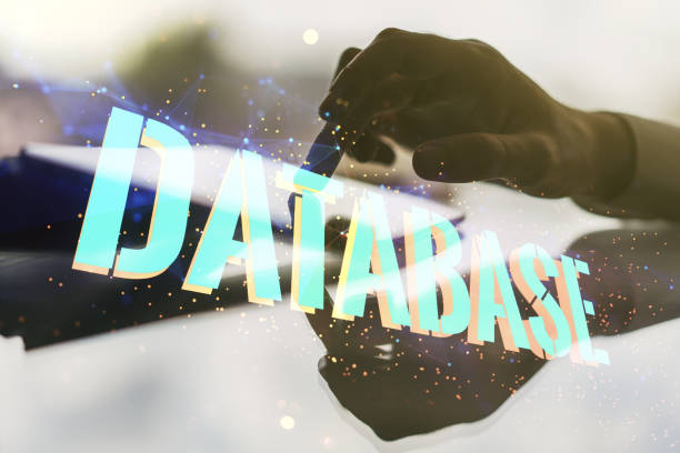 istock Double exposure of Database word sign with finger clicks on a digital tablet on background, global research and analytics concept 2152687884