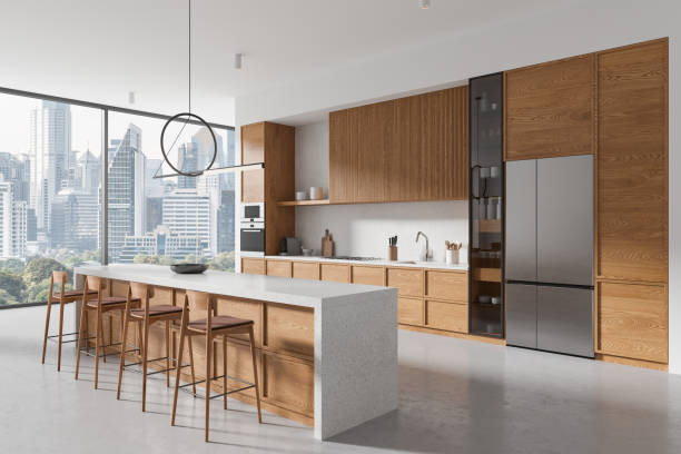 istock A modern kitchen with wood finish cabinets and a cityscape view in the background, emphasizing luxury and urban living, 3D Rendering 2152689970