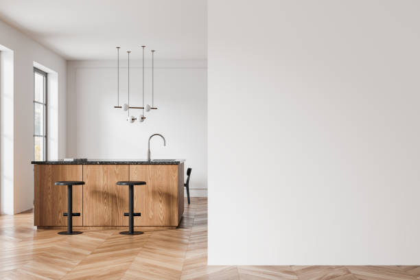 istock White home kitchen interior with bar counter, stool and window. Mock up wall 2152690022