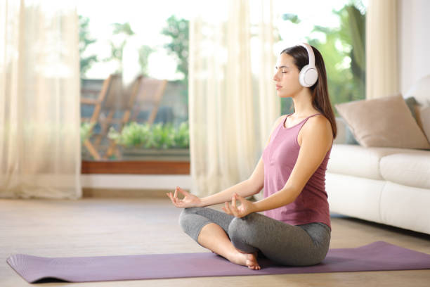istock Yogi doing guided yoga course at home 2152690047