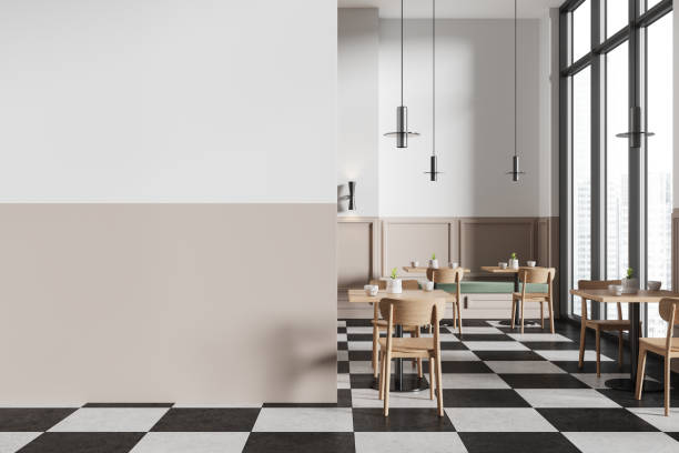 istock White and beige minimalistic checkered floor cafe interior with sofa and tables, blank wall 2152690822