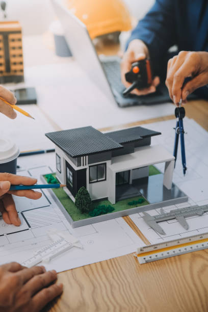 istock Image of engineer meeting for architectural project. working with partner and engineering tools on workplace vintage tone. 2152692031