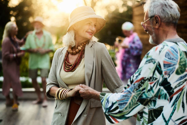 istock Smiling mature couple dancing on a party in the backyard. 2152692555