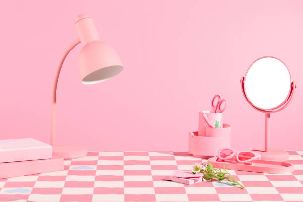 istock Some personal necessaries in pink color featured on the table has checkered pattern, on light pink background. Pink color concept for advertising, blank space in center for presentation 2152692963