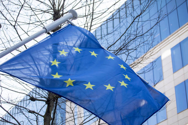 istock EU flag on a treelined street 2152693051