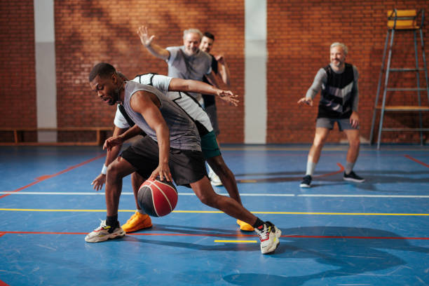 istock Young man dribbling in basketball game. 2152693174