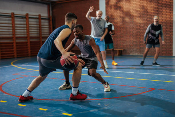istock Friends playing basketball. 2152693181