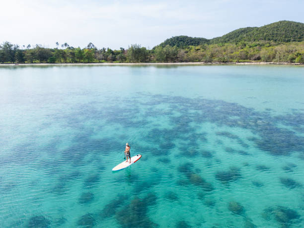 istock Paddleboarding Alone in Crystal Clear Island Waters 2152693347