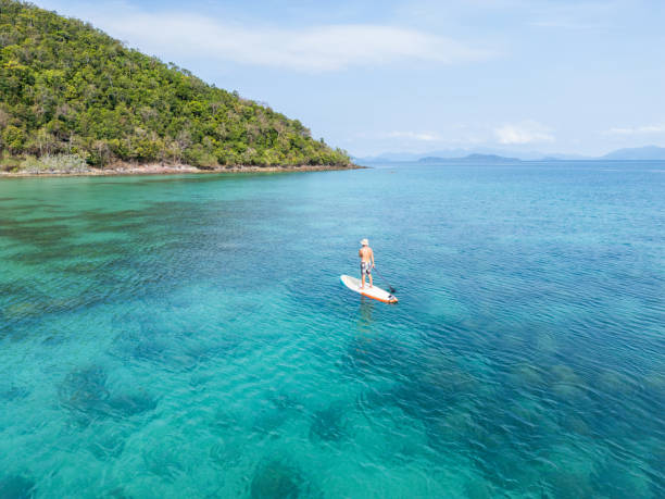 istock Paddleboarding in Calm Tropical Blue Waters 2152693385