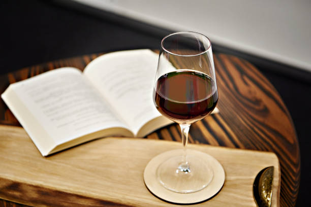 istock Glass of red wine and book 2152693623
