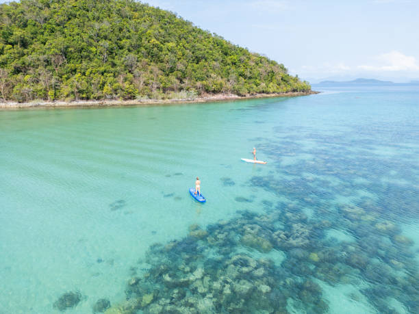 istock A couple Paddleboarding in Pristine Island Waters 2152693626