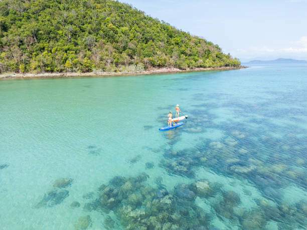 istock Two people on a  coastal journey with their paddleboard 2152693675