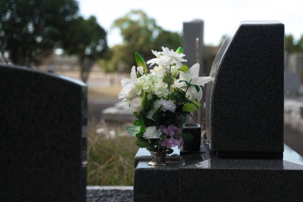 istock Fresh flowers offered in front of the grave 2152693738